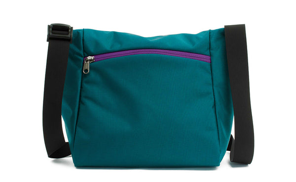 Reverse shot of an Icon in Seapine (bluish green) 630 Recycled with Ultraviolet (purple) zippers.